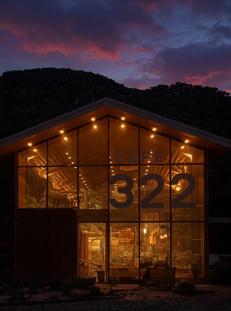 Convert this daytime photo to a beautiful dusk/twilight scene. beautiful gradient sunset sky, turn on all interior and ext...